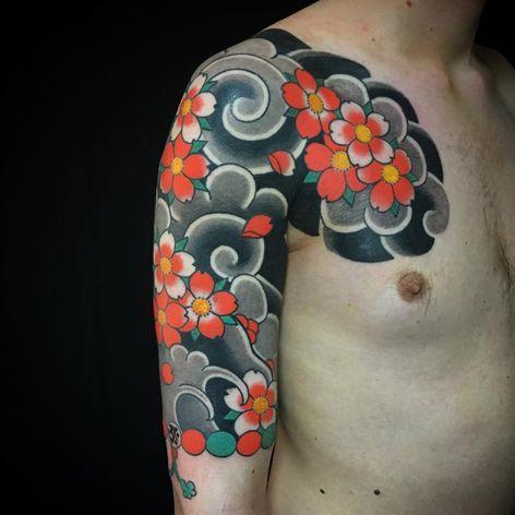 Traditional Japanese Tattoos Swirling with Cherry Blossoms • Tattoodo