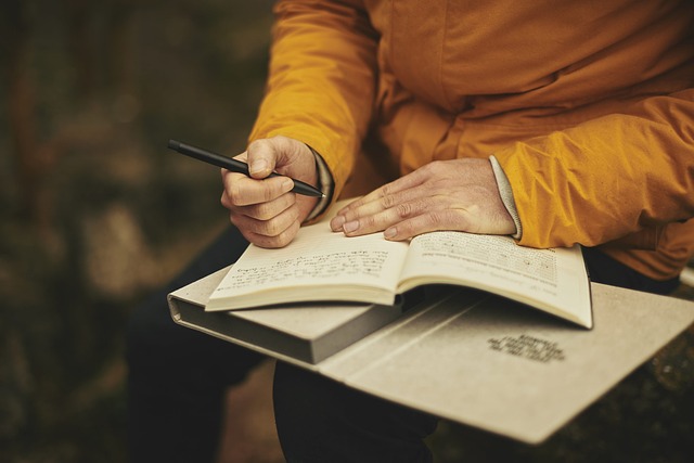 a lady journaling at night is one of the things to do while camping