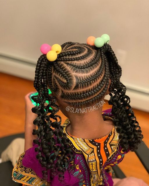 Back view of a beautiful girl rocking beautiful braids and curls