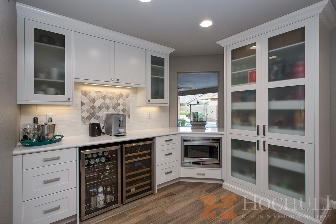 coffee bar area and pantry in this kitchen remodel