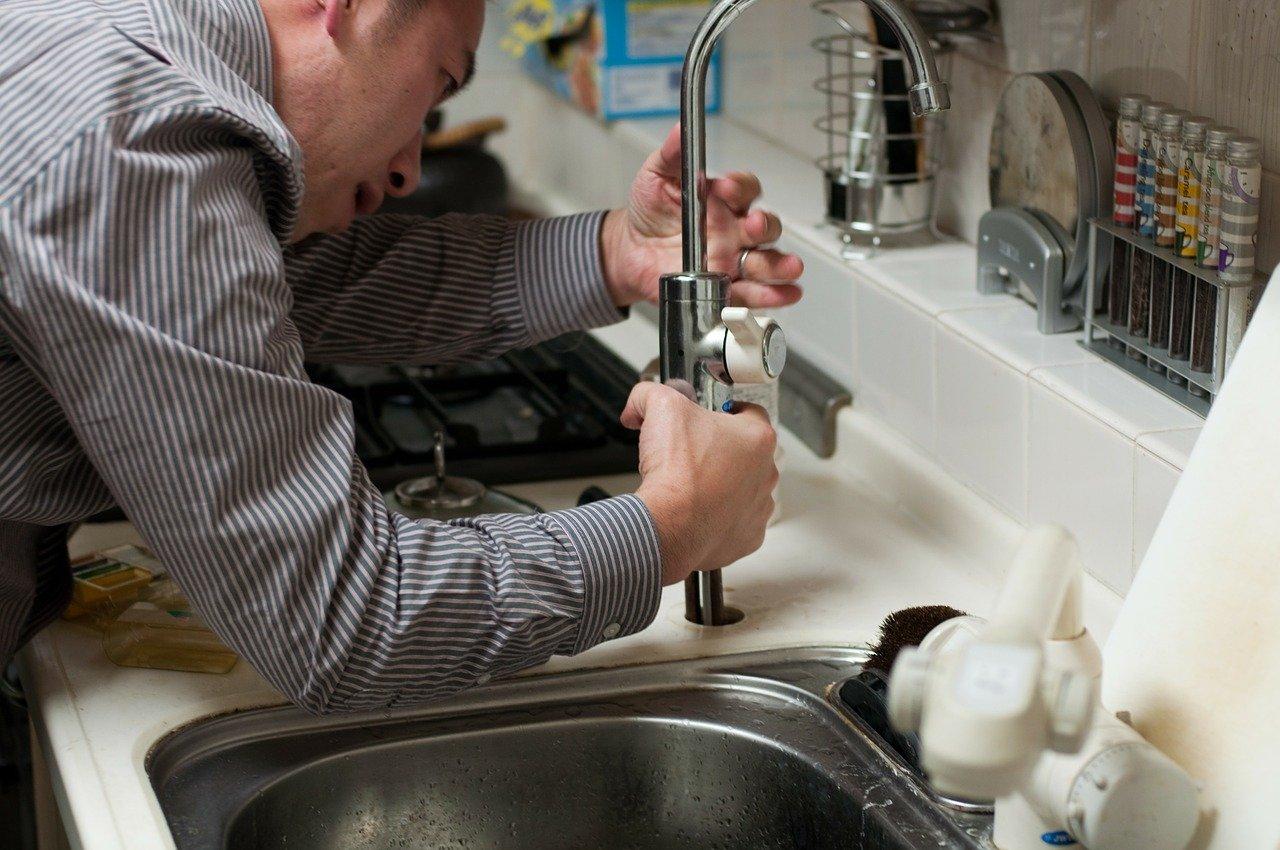 A person washing his hands in the sink

Description automatically generated with medium confidence