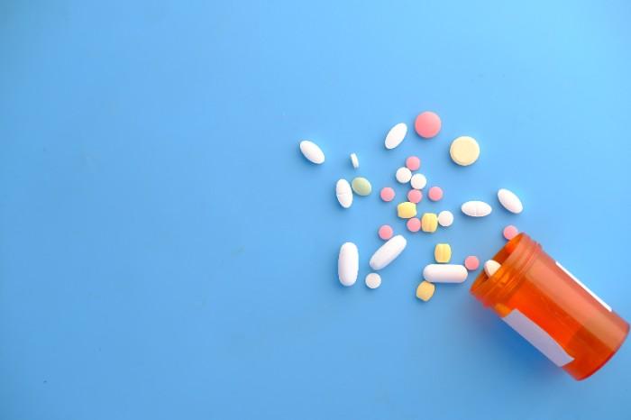 Medication spilling from a pill bottle