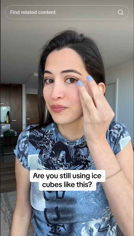 A screenshot of a woman on social media with some text at the bottom saying "are you still using ice cubes like this?"
