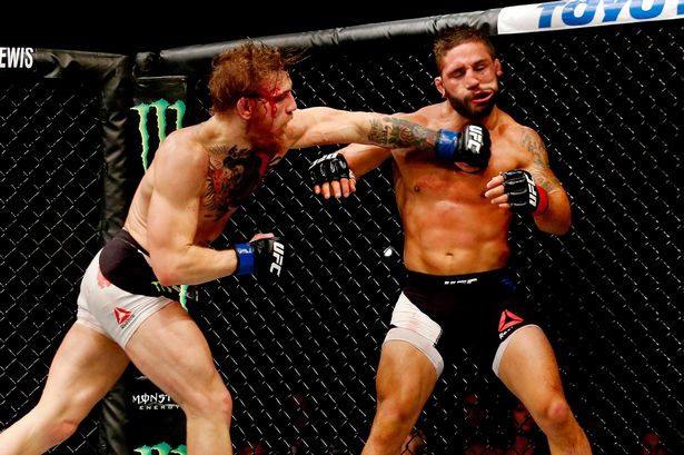 Conor-McGregor-punches-Chad-Mendes1.jpg