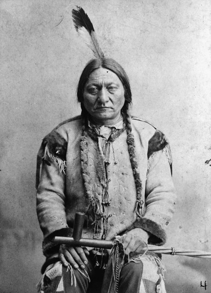 Description of  Sitting Bull c1884. Sitting Bull was shot and killed when police tried to arrest him outside his house on the Standing Rock reservation on December 15, 1890. After his death, members of his Hunkpapa band followed Chief Spotted Elk to Wounded Knee. Palmquist & Jurgens, photographer. (Denver Public Library; Western History Collection)