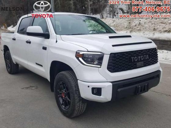 A white TRD Pro Toyota Tundra sits parked in the Nelson Toyota dealership