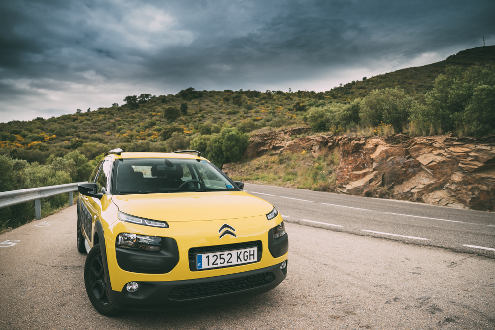 a car displayed in a scenic location