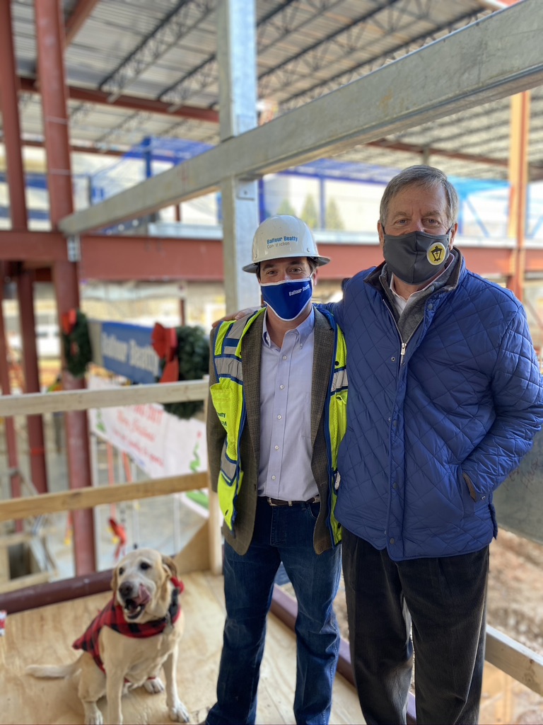 Atlanta Mission President/CEO, Jim Reese with construction worker inside the new Restoration House building under construction 