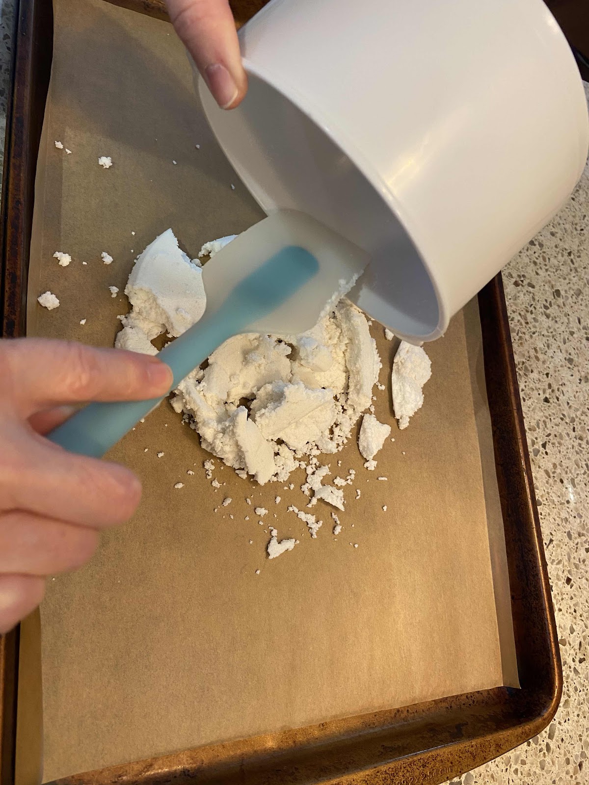 Spread the nut solids on a cookie sheet