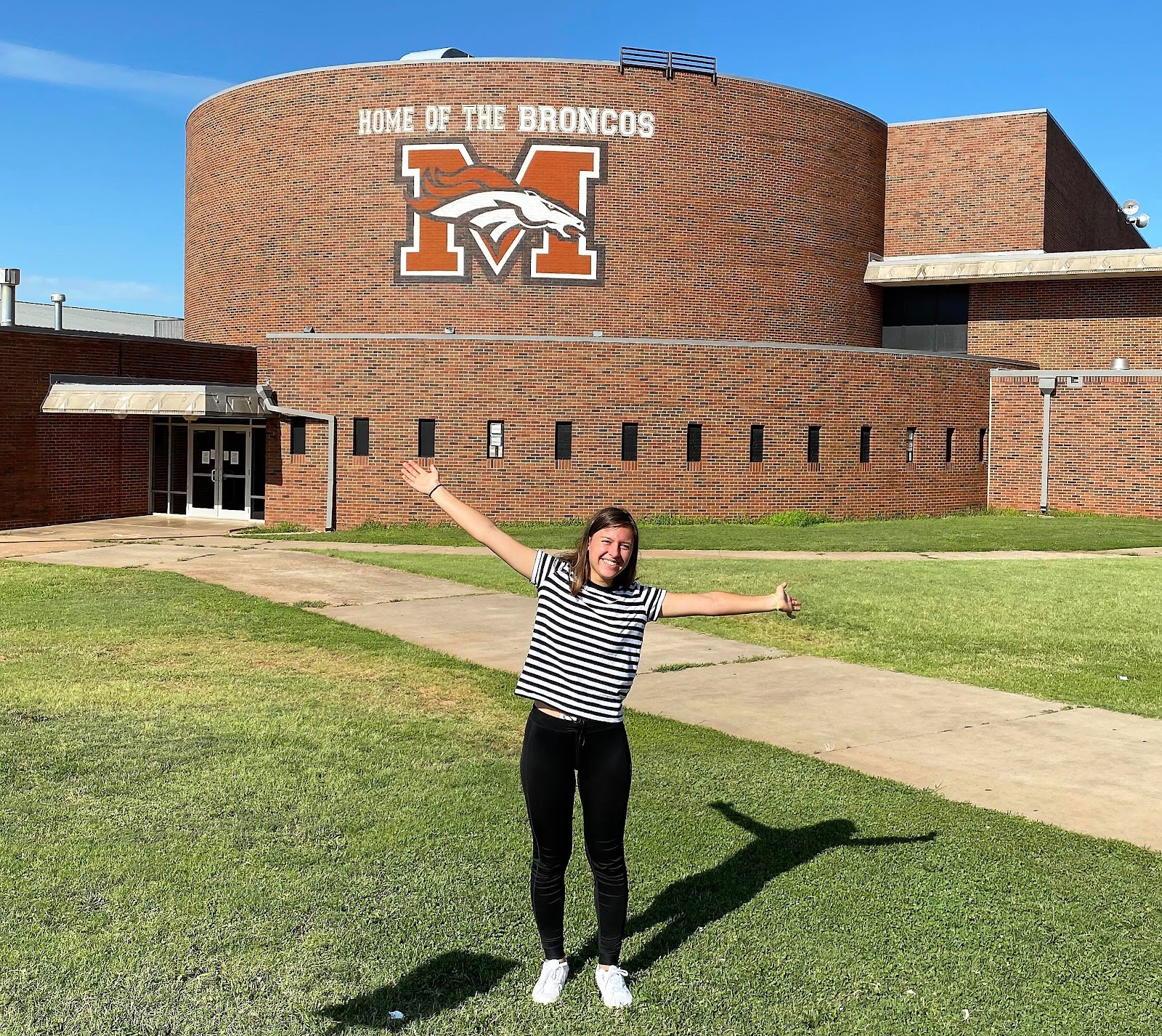 Exchange student in front of high school in USA