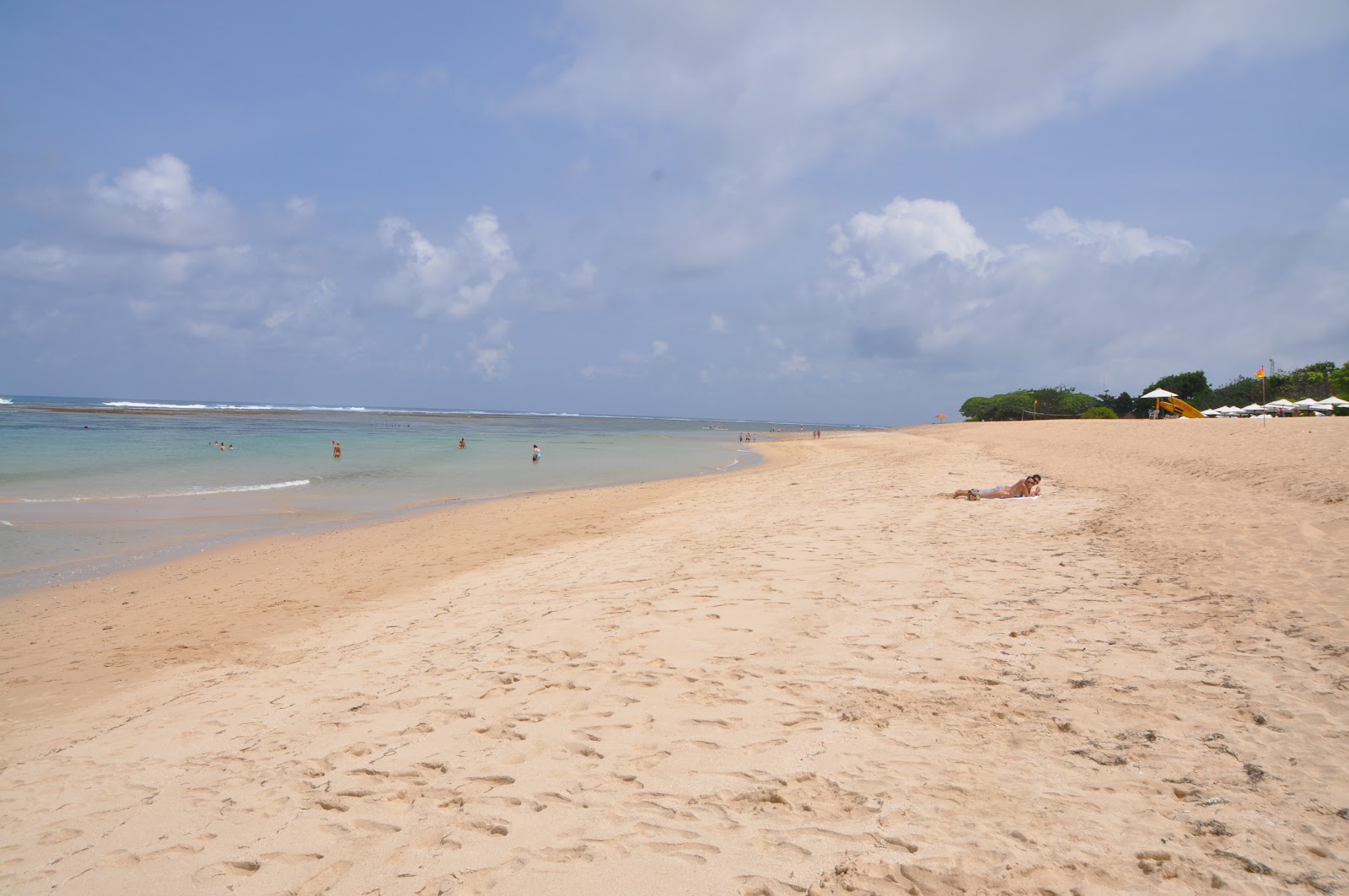 nusa dua calm wide sandy paradise beach blue ocean on a hot sunny day in bali indonesia