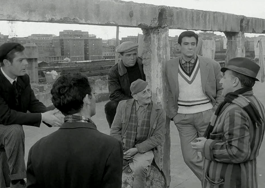 Marcello Mastroianni, Vittorio Gassman and others converse in a scene from ‘Big Deal on Madonna Street’
