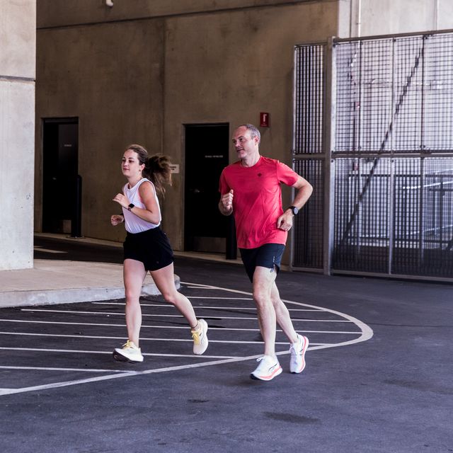 two runners in a parking garage