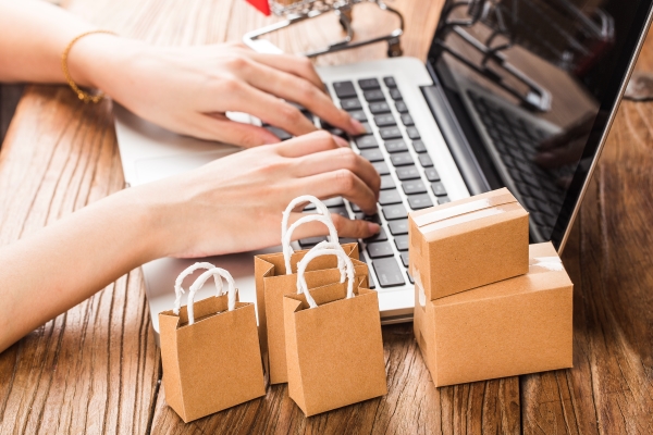 shopping-online-home-concept-cartons-shopping-cart-laptop-keyboard