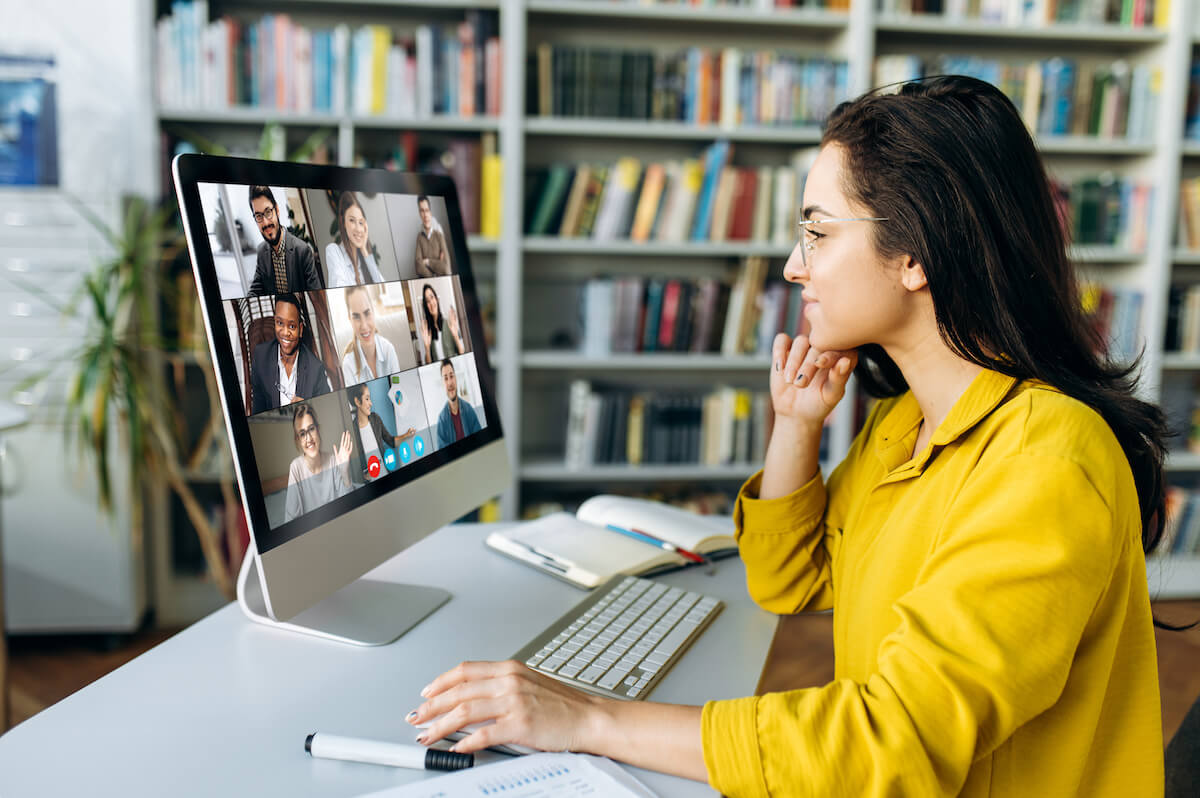 Trivia questions for work meetings: woman in a virtual meeting