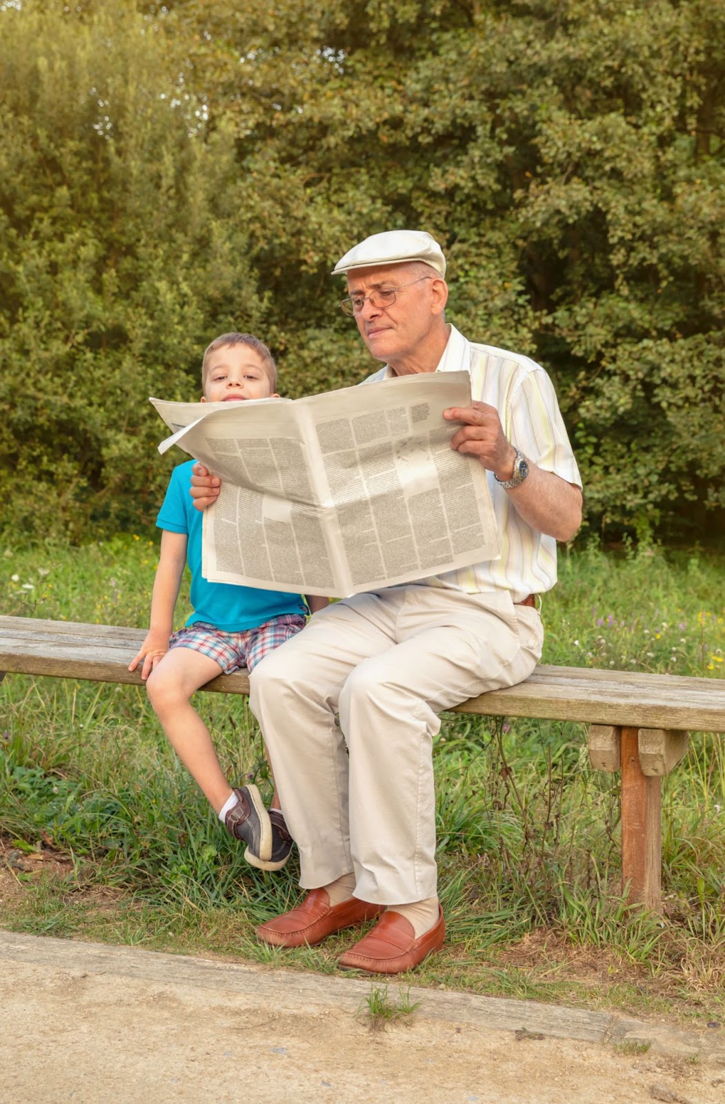 Grandfather and Grandson Reading Together