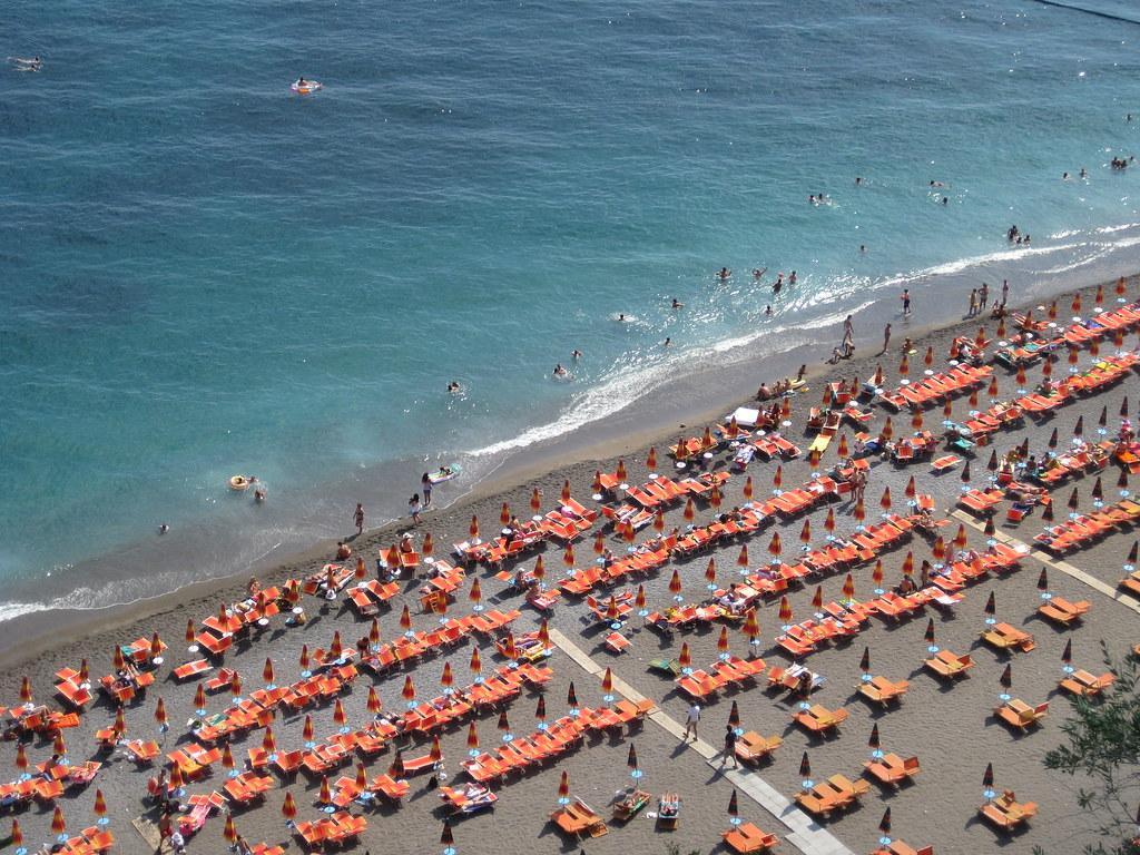 people sunbathing on the beach