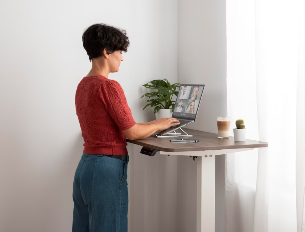 A height-adjustable desk designed for sitting and standing positions.