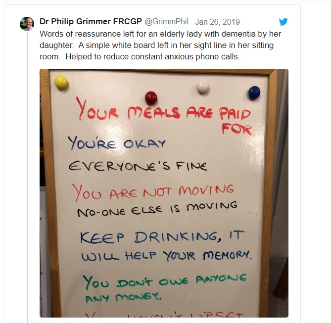 Whiteboard with list of comforting words on it for person with dementia
