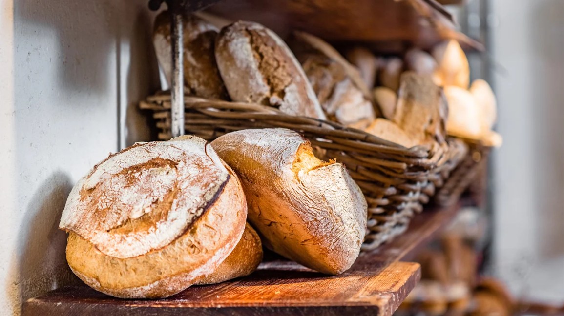 fresh loaves of bread in basket