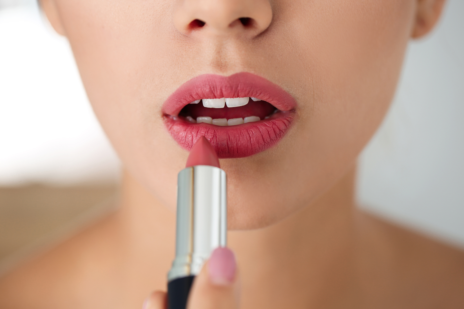 You can apply matte lipstick from the tube or with a brush.
