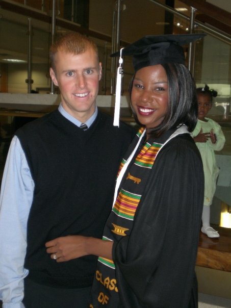 Interracial couple at college graduation. How to avoid college debt.