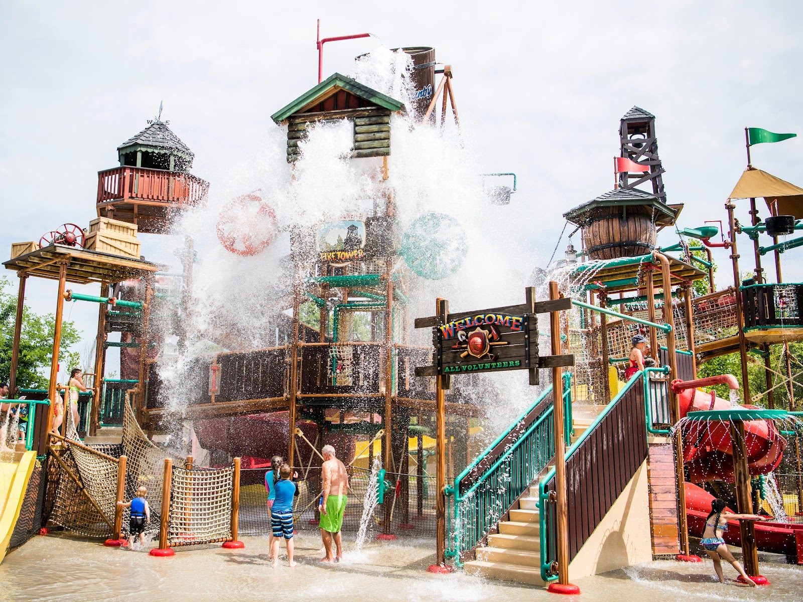 A gigantic bucket unleashes 1,000 gallons of water over the Bear Mountain Fire Tower at Dollywood's Splash Country on Thursday, May 30, 2019. 