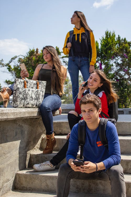 Group of high school students Sitting on Stairs