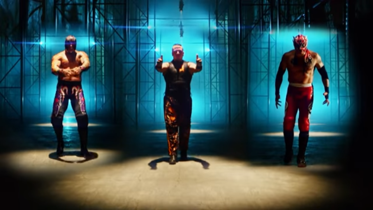 Screen cap from Lucha Underground. Three men (left to right: Mil Muertes, Jeremiah Crane, and Fenix) are standing in a warehouse and approaching the camera menacingly, doing their signature poses/stances. 