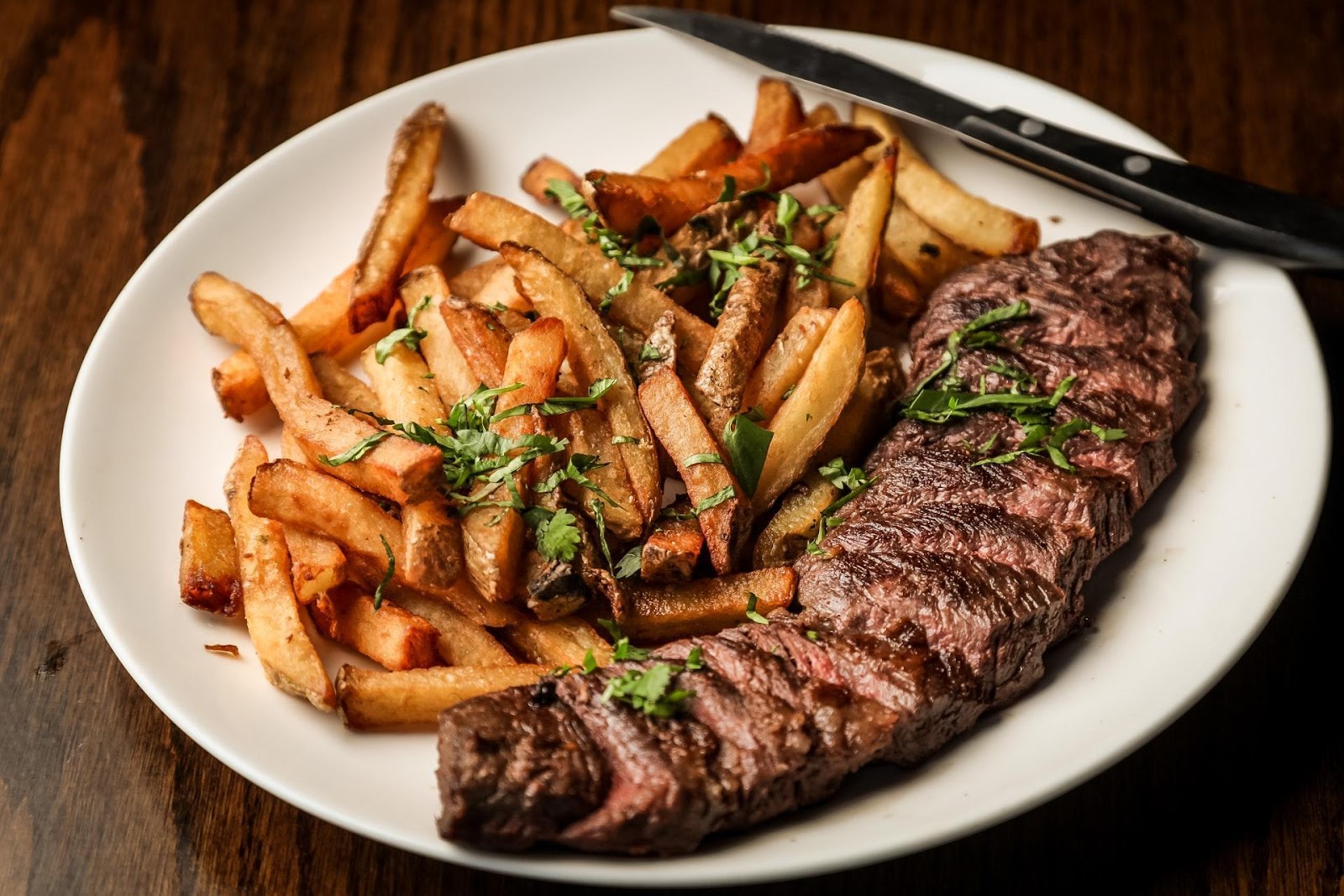 How to Cook Ribeye Steak on the Grill - Garnished Plate