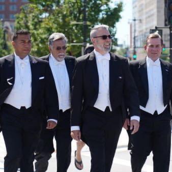 Men in suits walking on the street