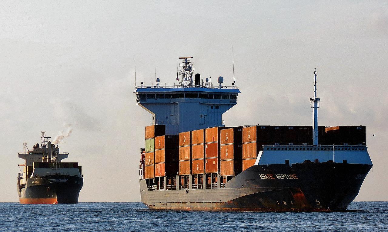 two sizable vessels sail through the ocean