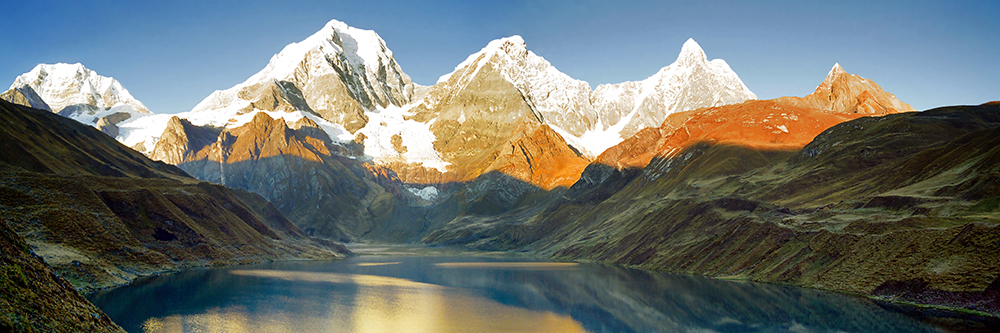 The Huayhuash mountain range reflecting in lake Carhuacocha at sunrise, Peru. Top Tourist Attractions in Peru