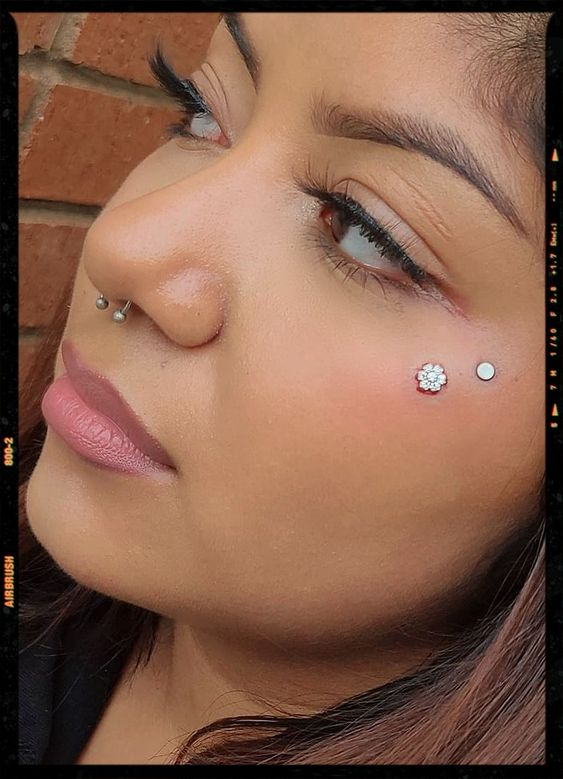 Full picture showing the anti-eyebrow face piercing