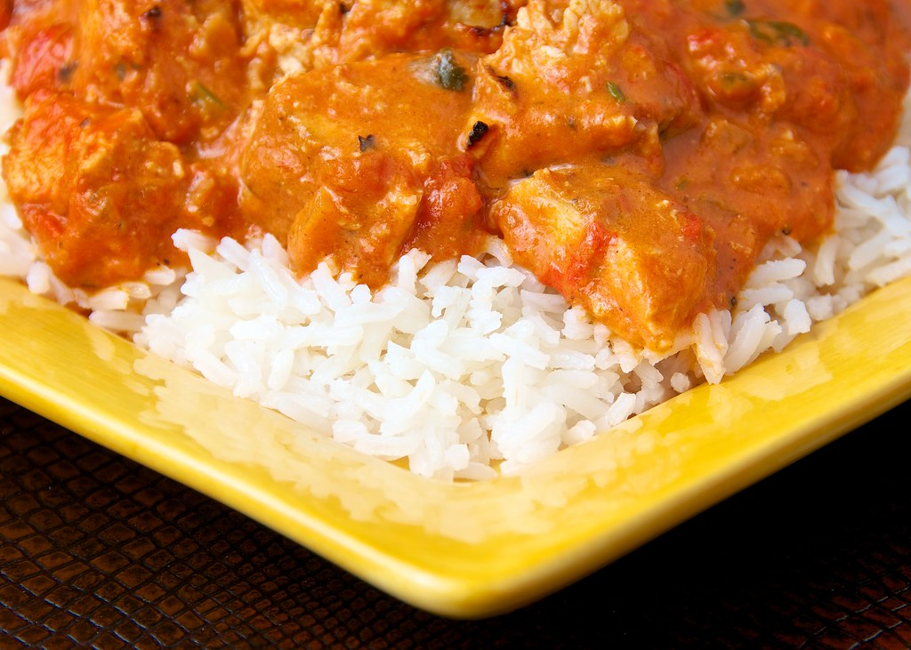 butter chicken over rice plate 