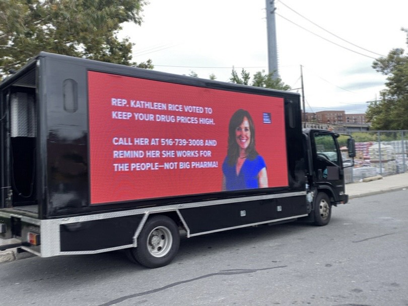 Image of our billboard truck on the road in Rep. Rice's district