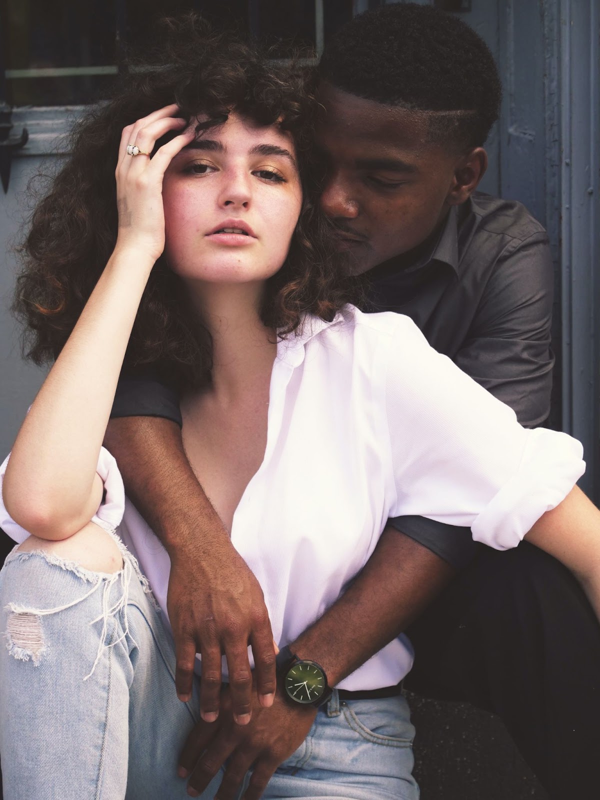 Black man with white female couple