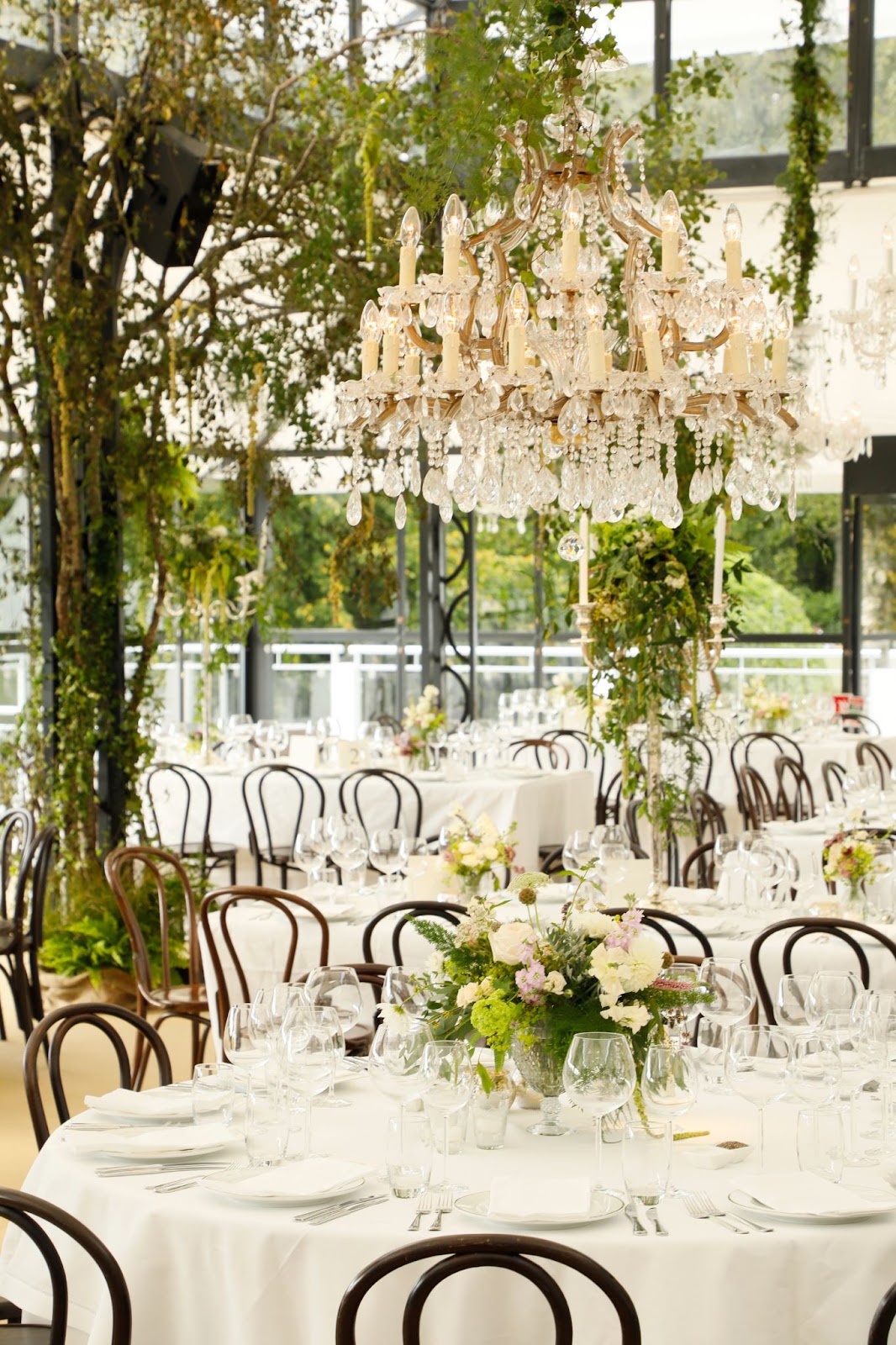 Tara Fay uses Chandeliers and florals to bring life to the wedding reception.