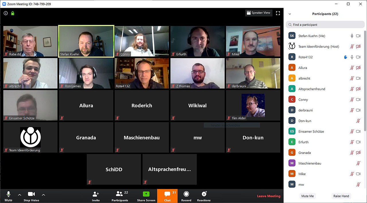 A screenshot of a large Zoom conference call in gallery mode, showing the video of many different participants.