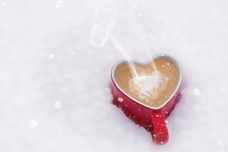 a heart shape cup with cooffe