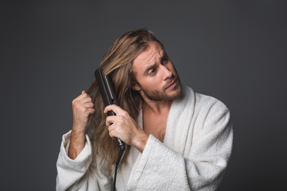 men using hair straightener