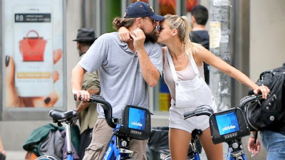 Leonardo DiCaprio gets close with new girlfriend, model Kelly Rohrbach, and shares a sweet kiss while out riding Citi Bikes, June 9, 2015, in New York City.