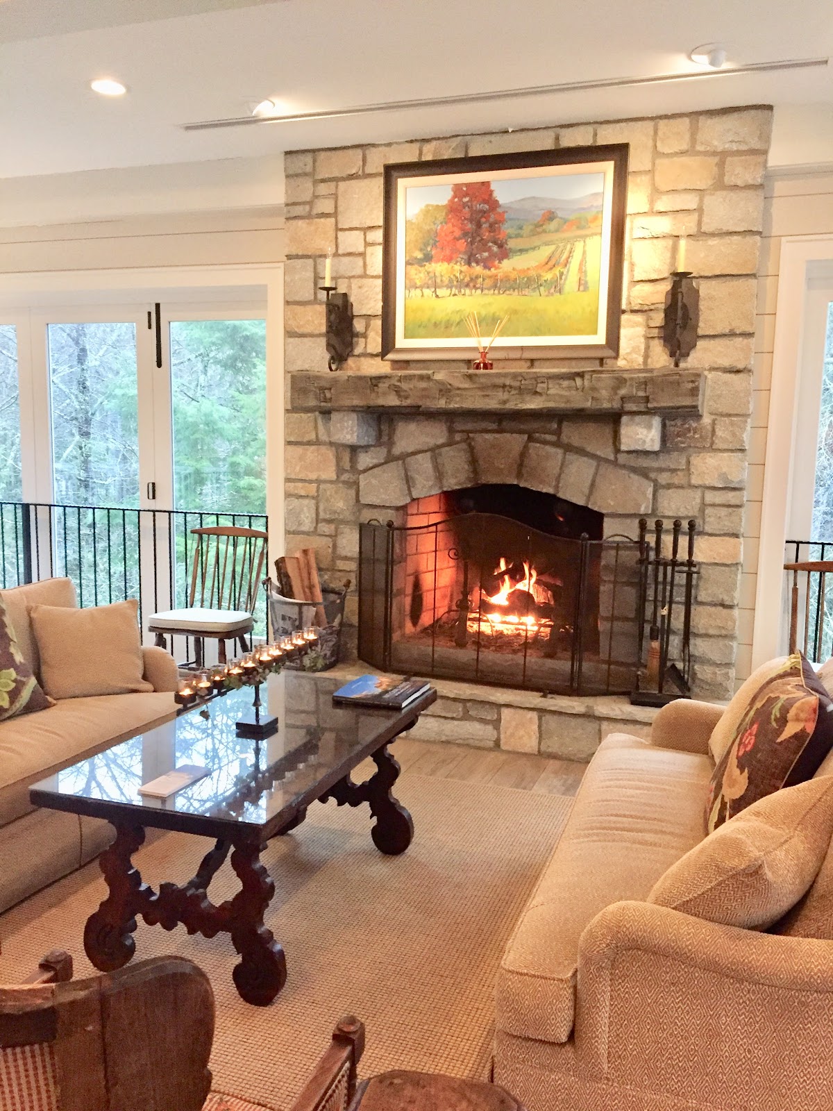 Stone Fireplace Burning With Screen
