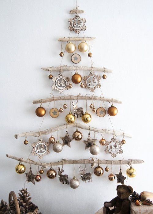 Sustainable DIY Christmas tree alternative made from hung branches with ornaments 
