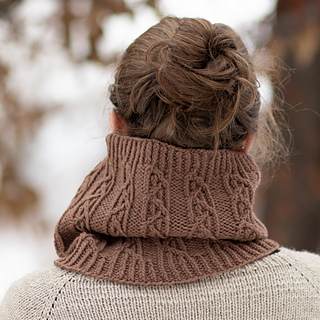 woman wearing a cable knit cowl
