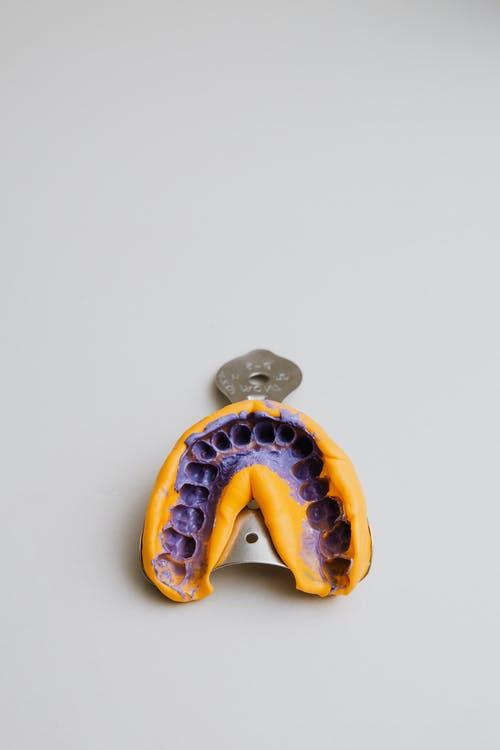 Free Top view of colourful dental alginate oral impression on impression tray for denture placed on white background Stock Photo