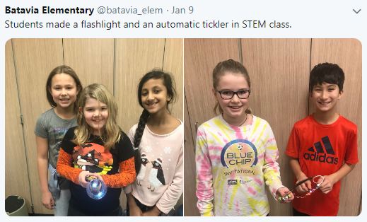 Elementary STEM Students A picture of elementary STEM students holding their inventions which include a flash light and an automatic ticking device.
