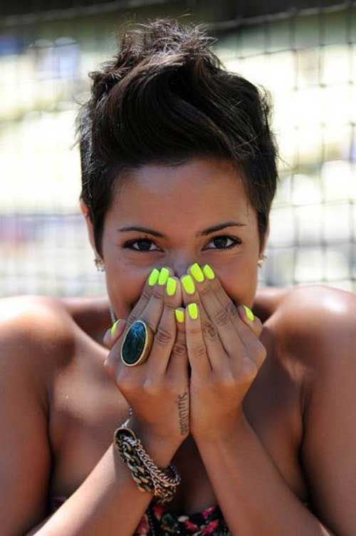 Portrait of a lady rocking a cute neon short nail