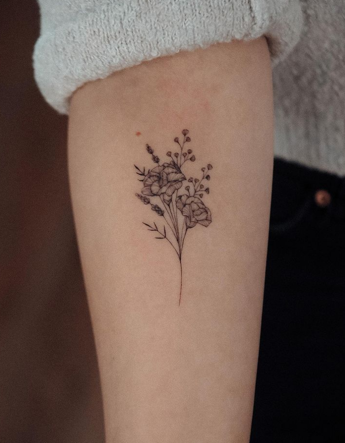 tiny flower tattoo