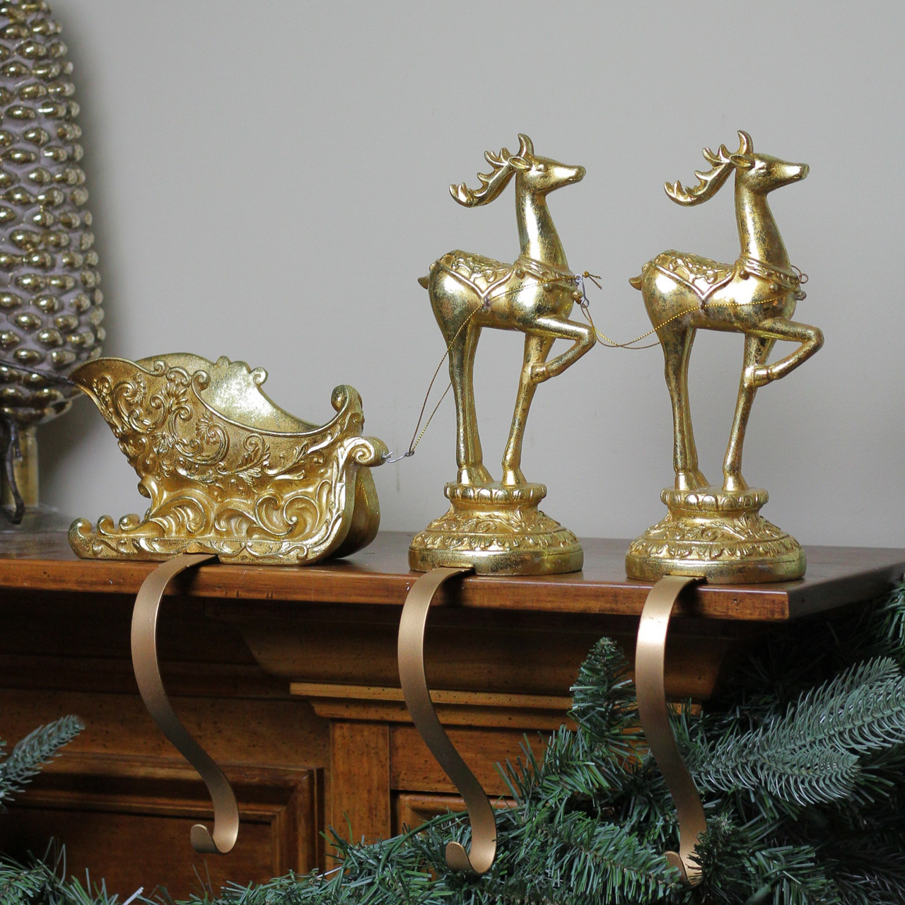Gold sleigh and reindeer stocking holder set